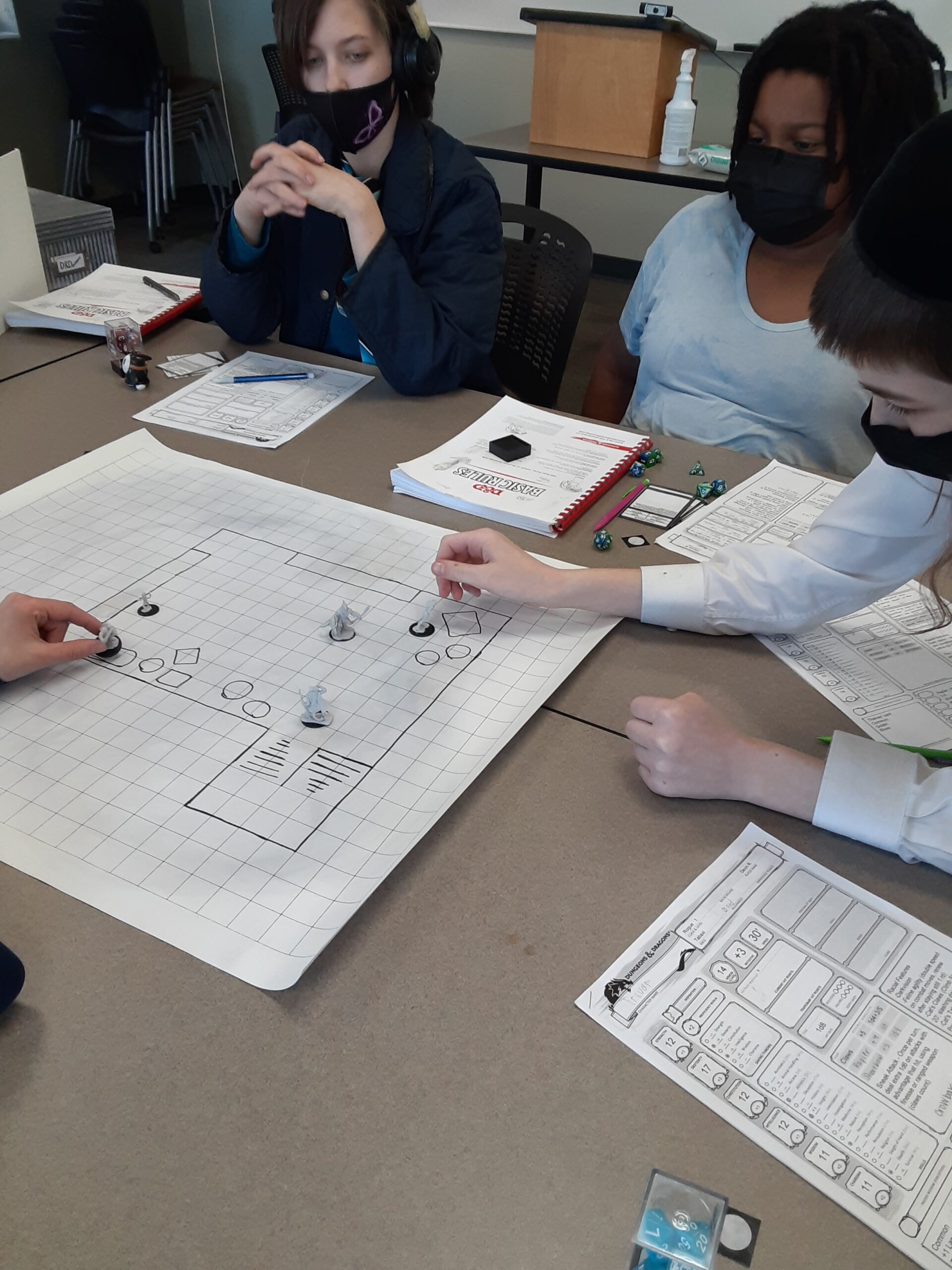 Kids participate in Dungeons and Dragons game at a session.